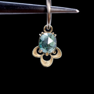 The Violet Charm Blue-Green Sapphire 10.1mm x 8.6mm
