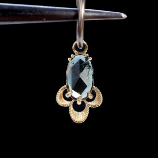 The Violet Charm Blue-Green Sapphire 11.8mm x 7.9mm